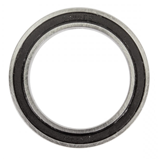 A close-up of a circular metal bearing or seal with a black rubber inner ring, shown on a plain white background.