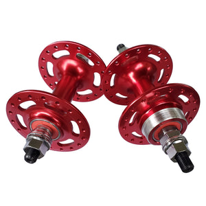 Two red bicycle hubs on a white background