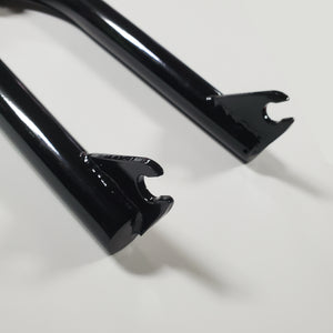 Close-up of a black bicycle fork on a white background