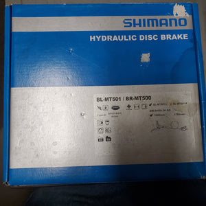 Shimano hydraulic disc brake packaging with visible branding and product details.