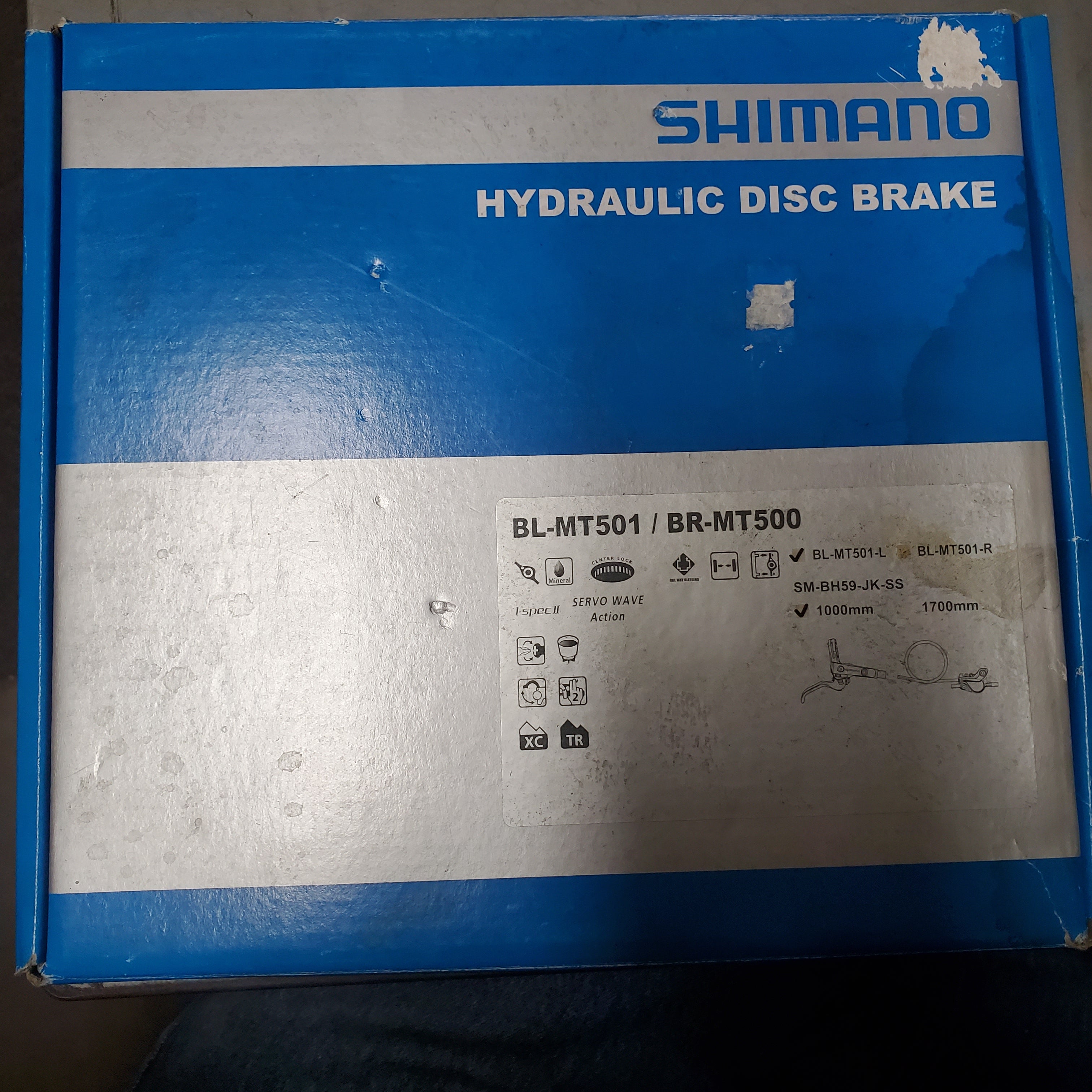 Shimano hydraulic disc brake packaging with visible branding and product details.