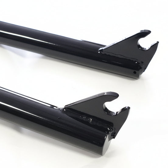 Two black metal brackets on a white background