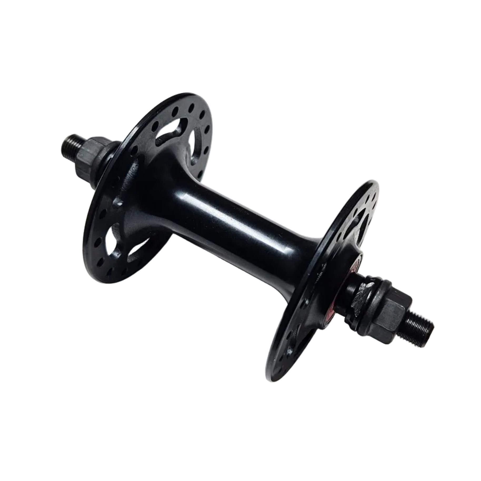 Black bicycle hub on a white surface with a concrete floor background