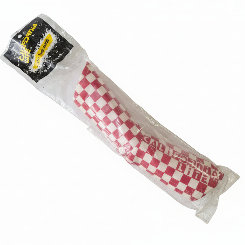 Checkered product wrapped in plastic on a white background