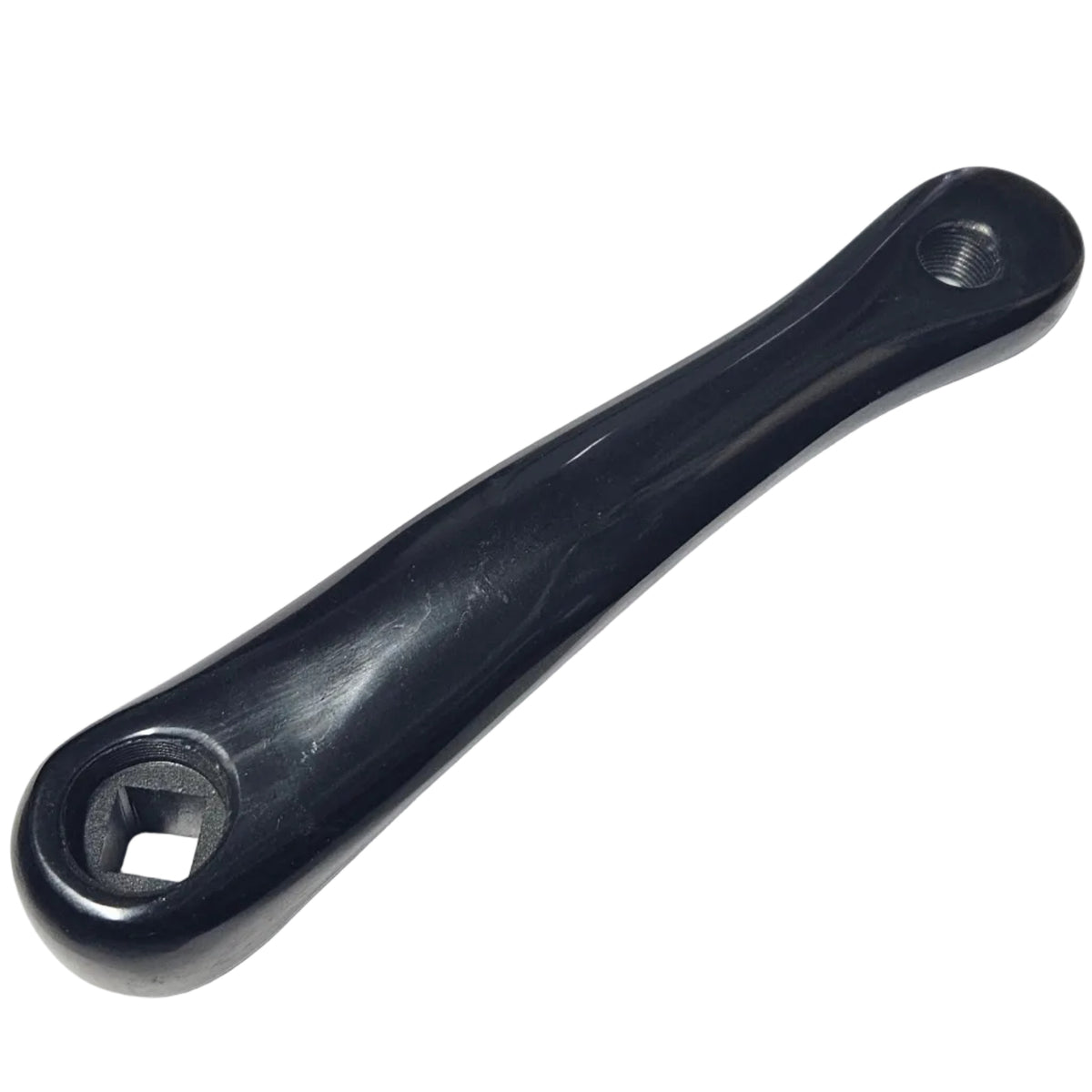 Black bicycle crank on a white surface with a blurred background