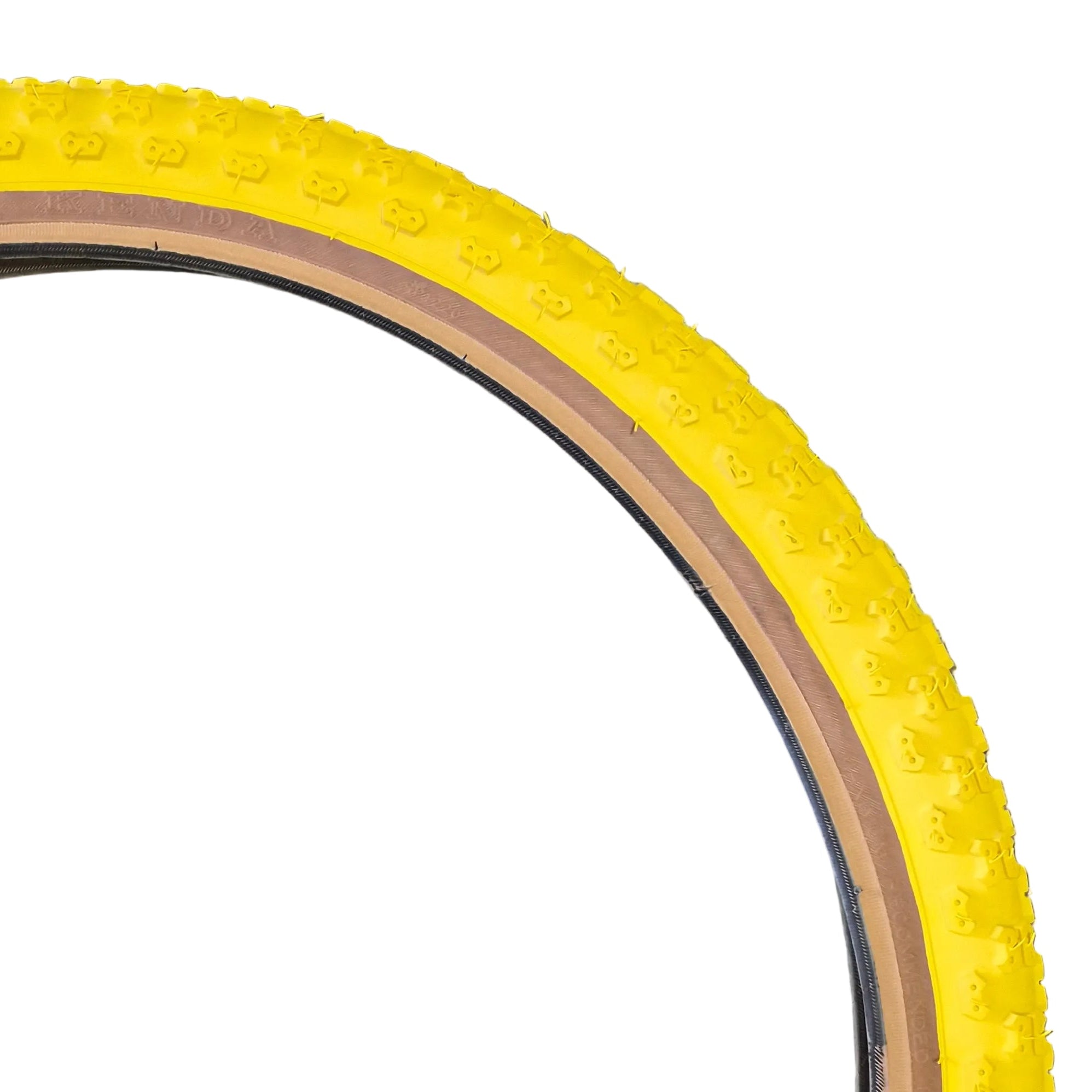 Yellow bicycle tire with tread pattern on a white background