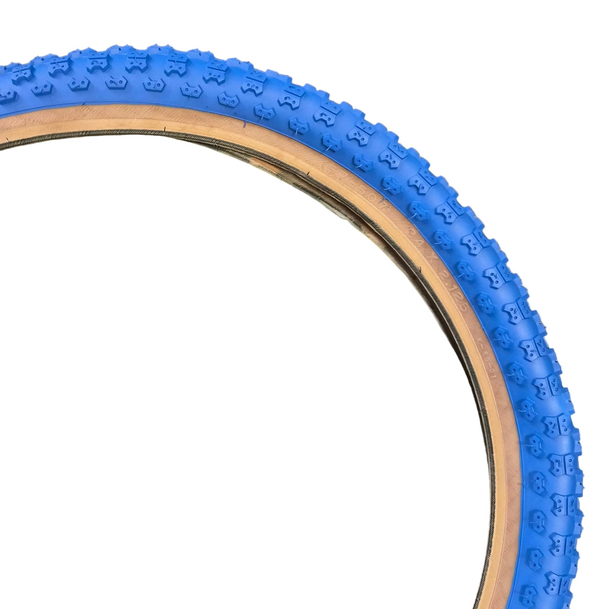 Tire with blue sidewall on a concrete surface