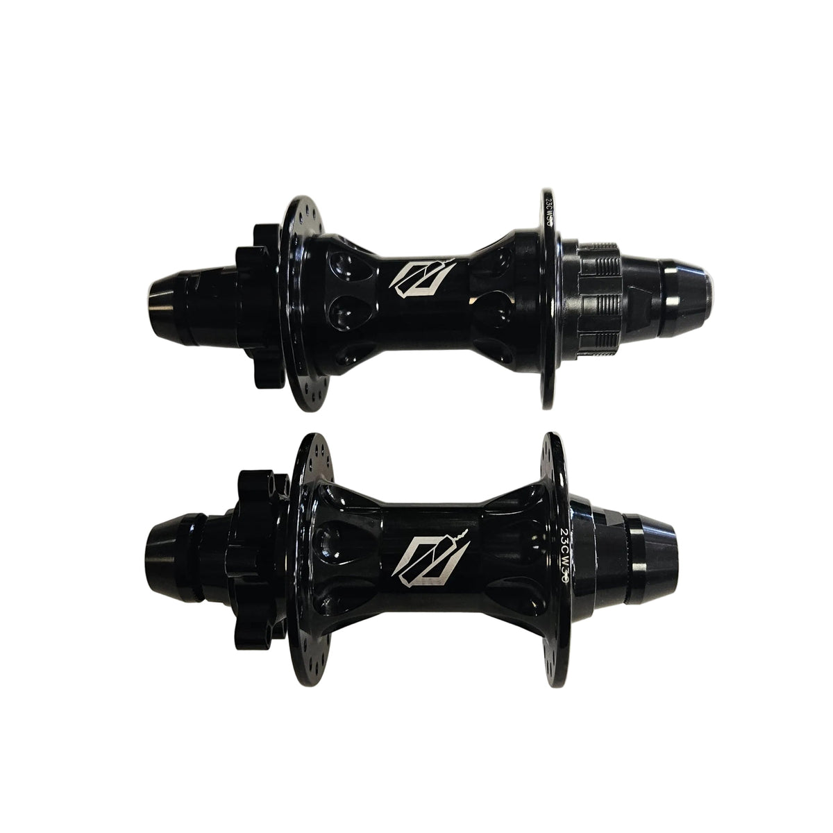 Two black bicycle hubs on a white background