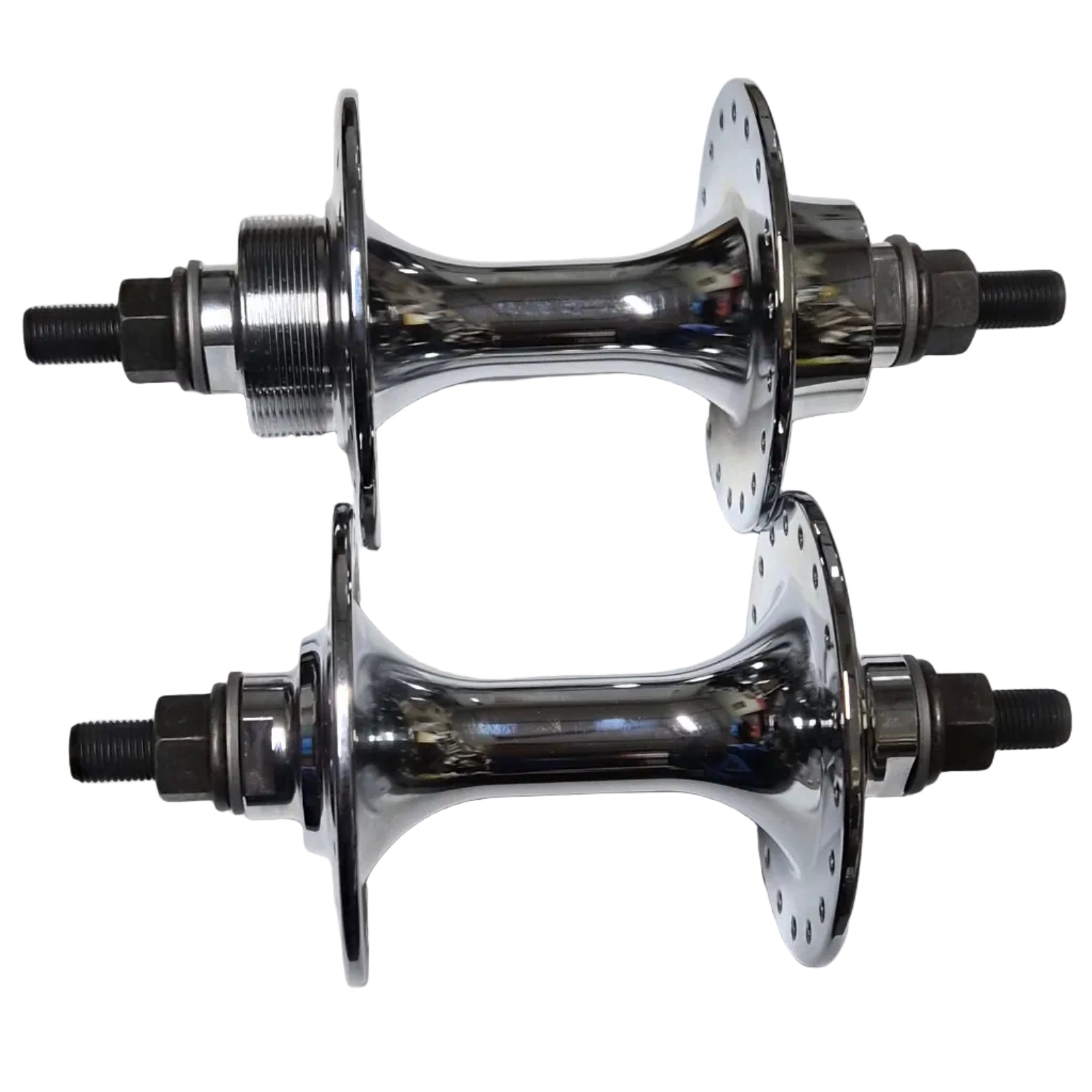 Two metallic hub bearings on a white sheet of paper with a metal surface background