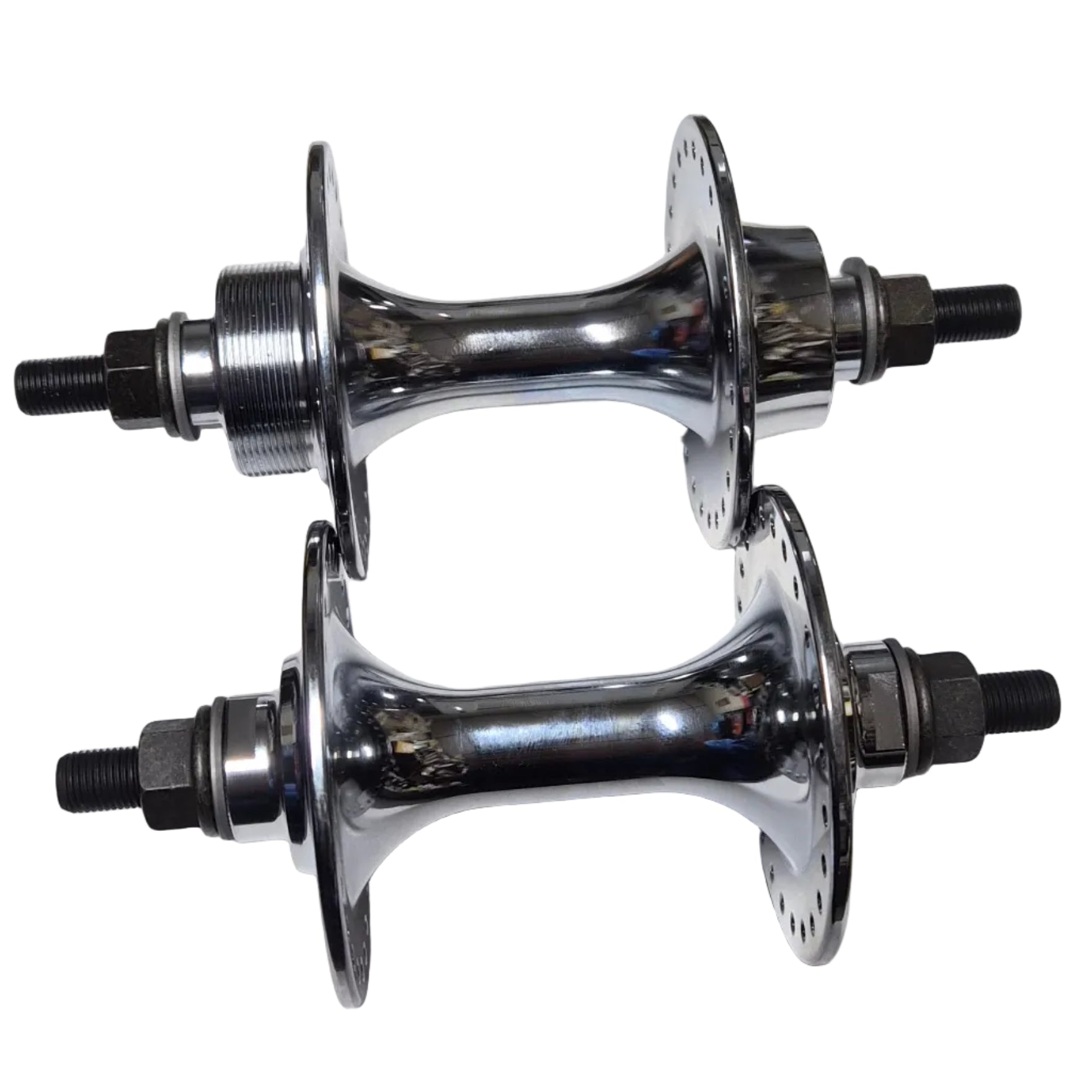 Two chrome bicycle hubs on a white sheet of paper with a wooden surface underneath.