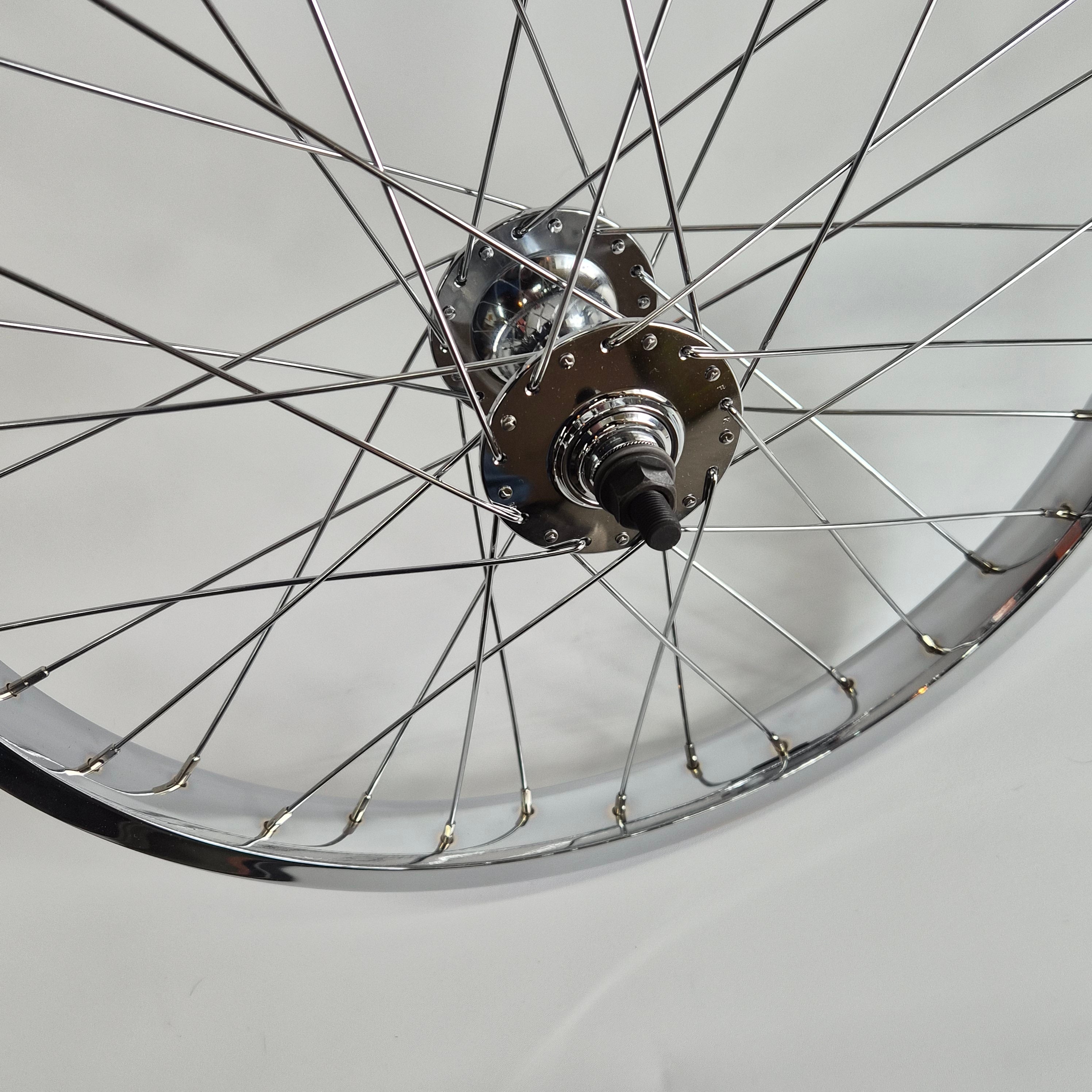 Close-up of a bicycle wheel hub on a white background