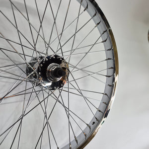Close-up of a bicycle wheel hub on a white background