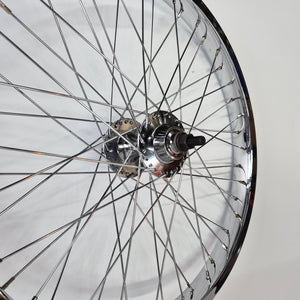 Close-up of a bicycle wheel hub on a white background