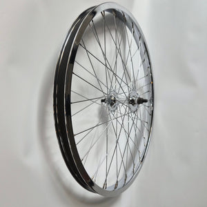 Bicycle wheel mounted on a white wall