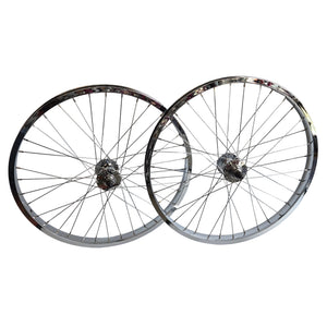 Two bicycle wheels stacked on a white background