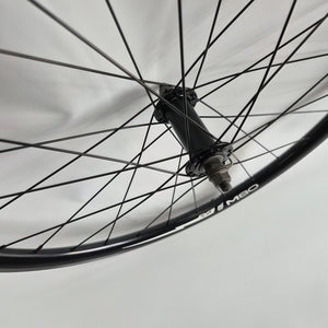 Close-up of a bicycle wheel with a blurred background