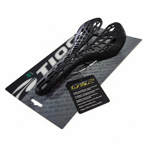 Black metal object on a branded box with a label