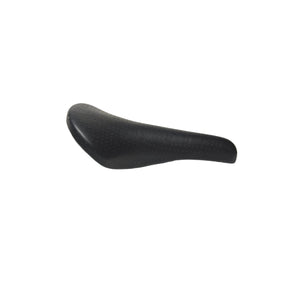 A black bicycle saddle with a textured, perforated surface, shown from a side profile on a white background.