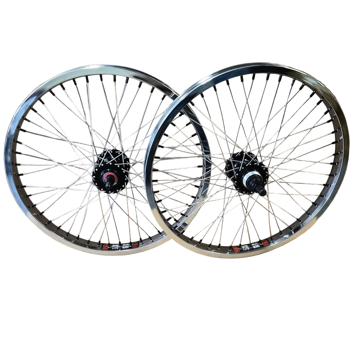 Two bicycle wheels with silver rims and spokes, black hubs, and small red and white decals, displayed against a brown cardboard background.