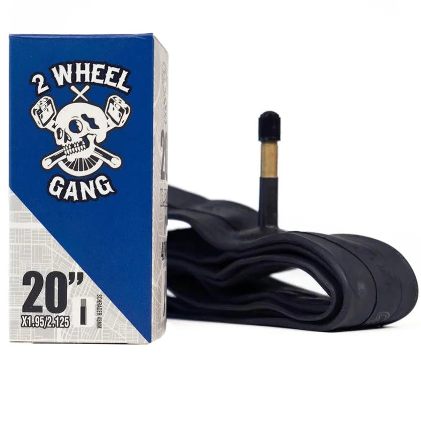 Bicycle inner tube with valve and '2 Wheel Gang' branded packaging on a white background