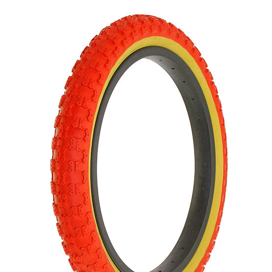 A red bicycle tire with a gumwall designed for BMX bikes.