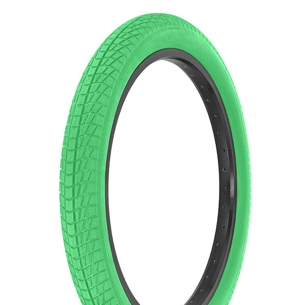 Green tire with black rim on a white background