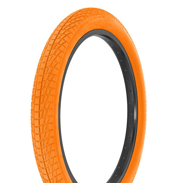 Orange tire with black bead on a white background
