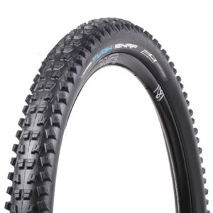 Close-up of a black bicycle tire with tread pattern on a white background