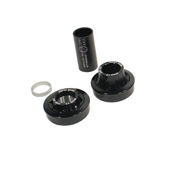 Black metal bearings and washers on a white background