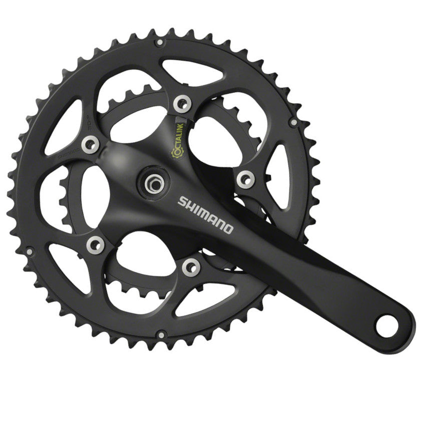 Shimano bicycle crankset with chainring on a white background