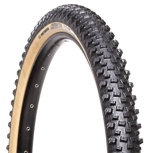 Bicycle tire with knobby tread pattern on a white background