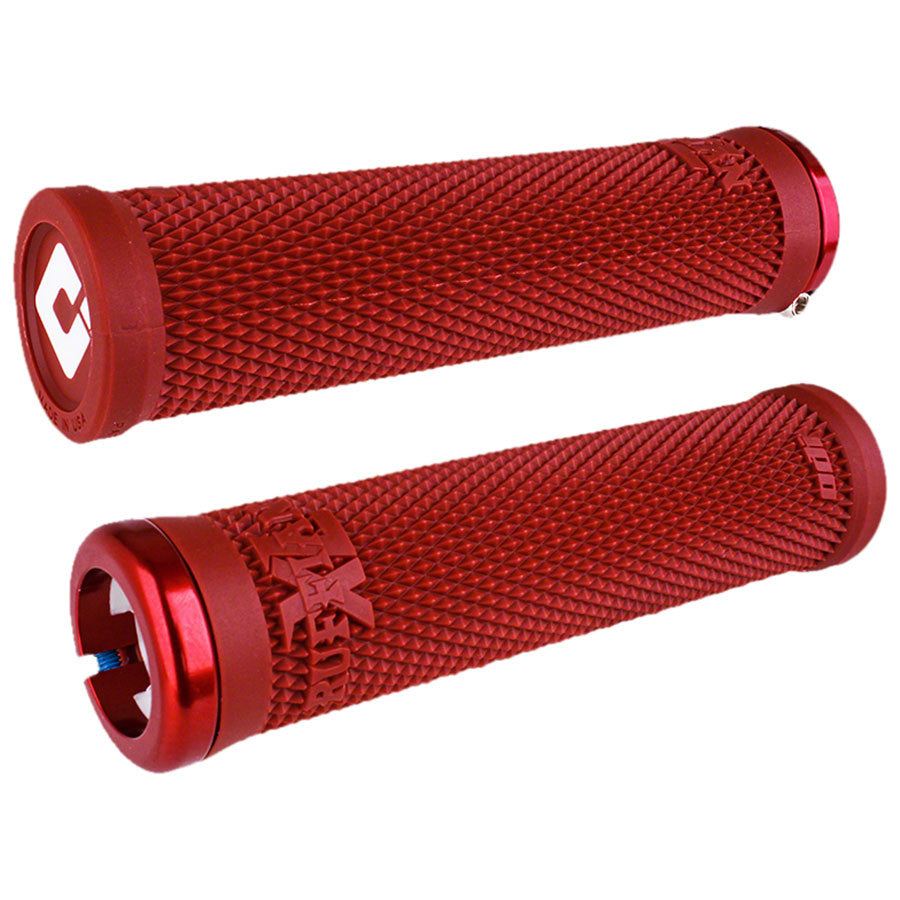 Red bicycle grips with textured surface on a white background