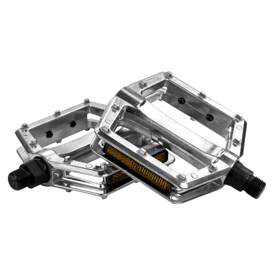 Pair of silver metal bicycle pedals on a white background
