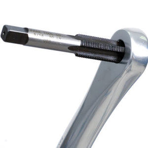 Close-up of a metallic tool with a black handle on a white background