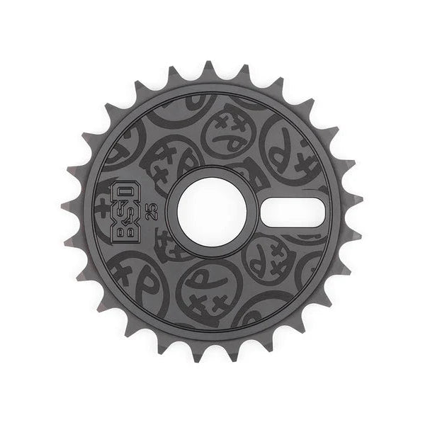 A dark gray bicycle chainring with embossed circular graphic patterns, shown against a plain white background.