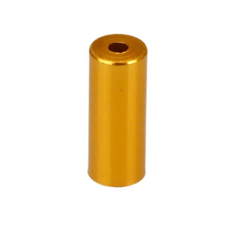 Gold cylindrical metal object on a white background
