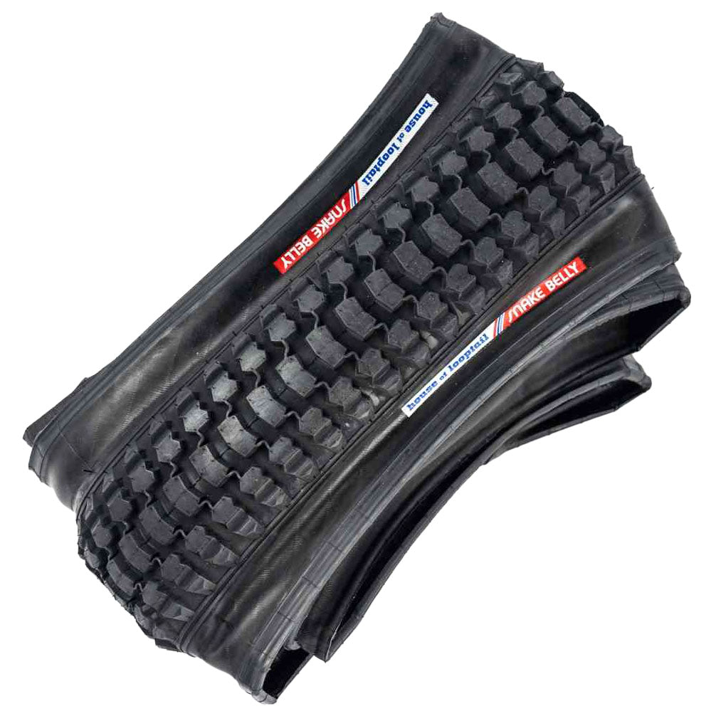 Black bicycle tire with tread pattern on a white background