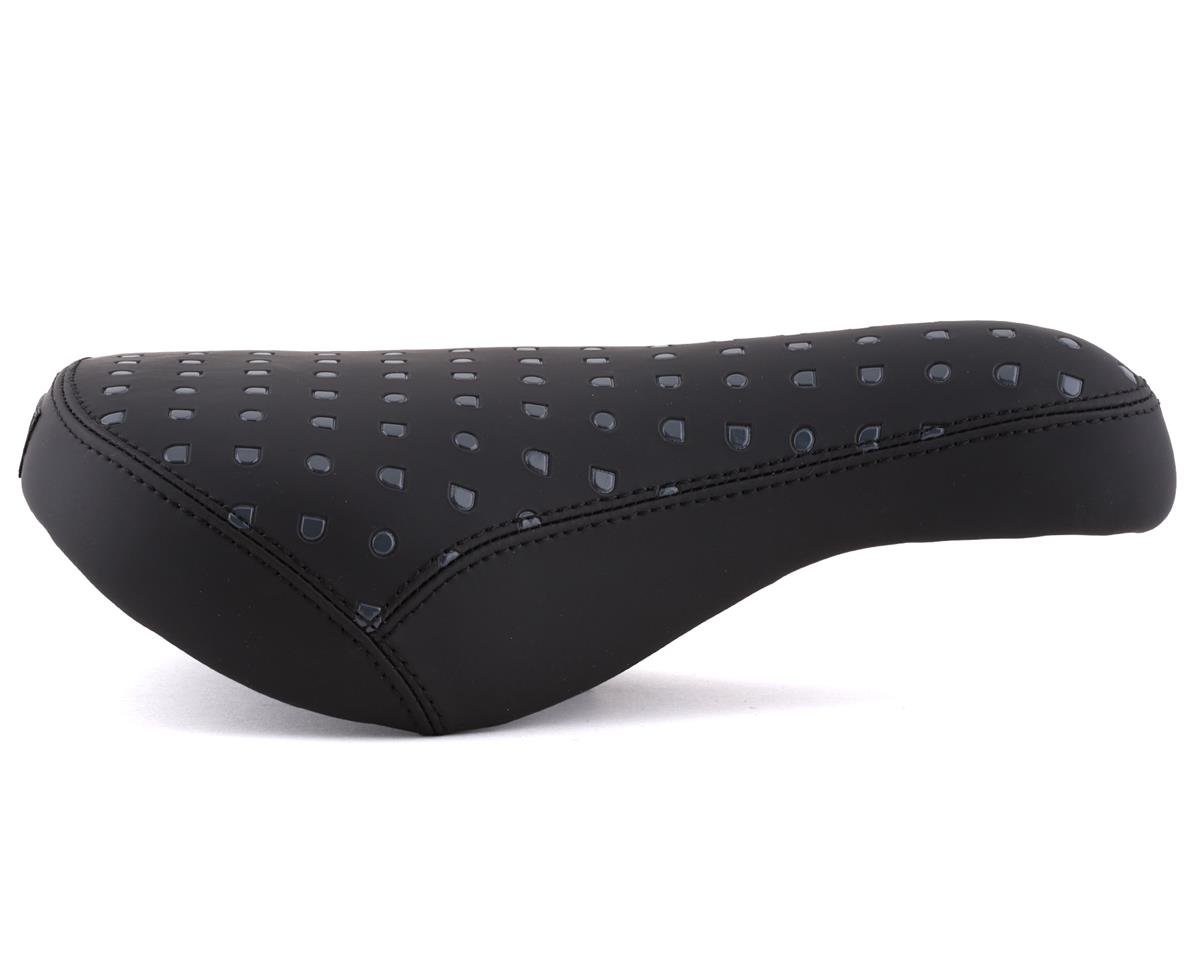 Black bicycle seat with diamond pattern on a white background