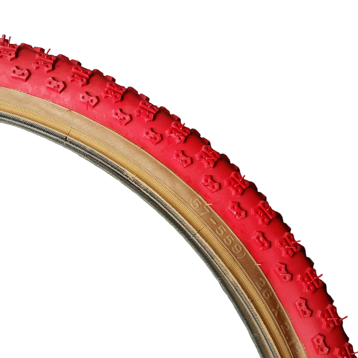 A red Kenda BMX tire with a skinwall and a tread pattern, laying on a flat surface.