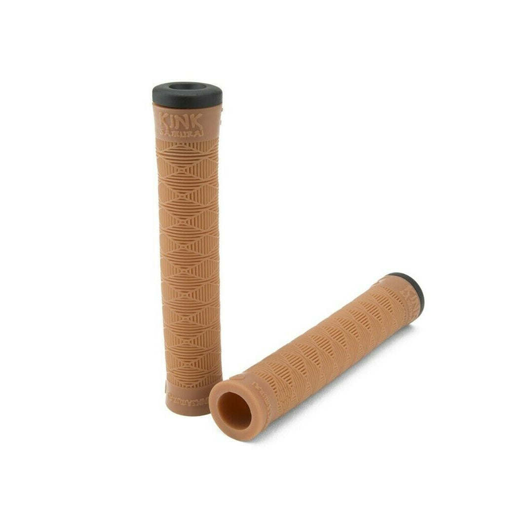 A pair of gum colored bicycle handlebar grips with bar ends, placed side by side against a white background.